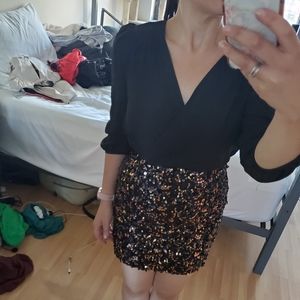 Long sleeved mini dress with sequin bottom